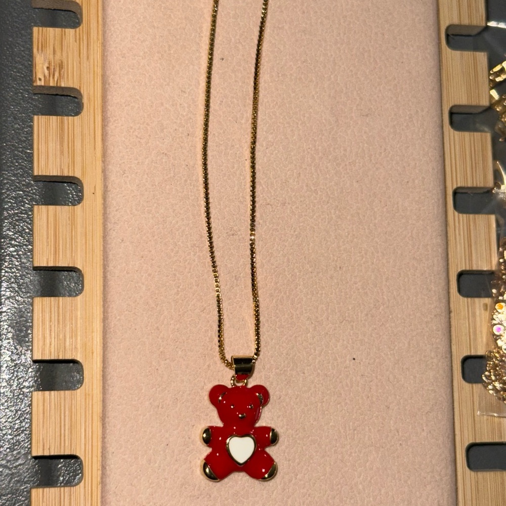 Elegant Gold Necklace with Red Teddy Bear Pendant